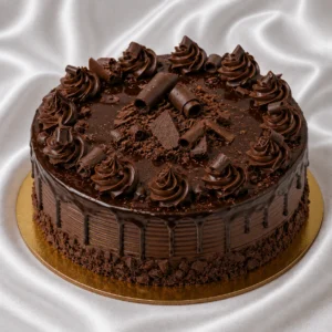 Decadent multi-layer chocolate cake with
  dark ganache, curls and glossy topping