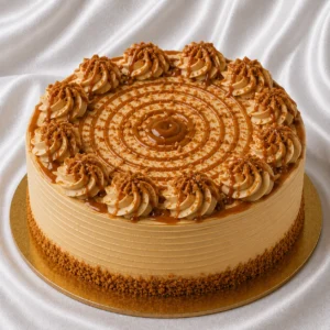 Dulce de leche cake with caramel-colored
  cream and glossy caramel drizzle