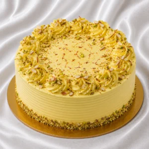 Kesar Kulfi cake with saffron-infused
  cream, pistachio and almond garnish