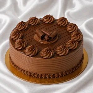Nutella cake with chocolate hazelnut
  frosting, ganache and hazelnut pieces