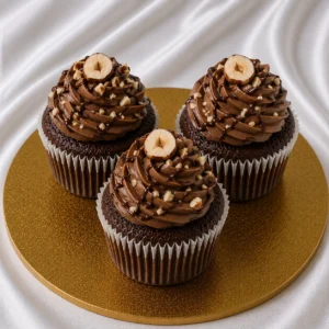 Set of Nutella cupcakes with chocolate
  hazelnut frosting, ganache and hazelnut pieces