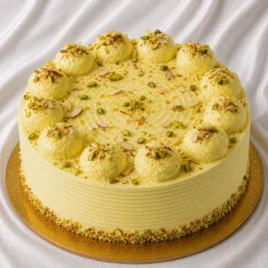 Rasmalai cake with saffron-tinted cream,
pistachio and almond garnish