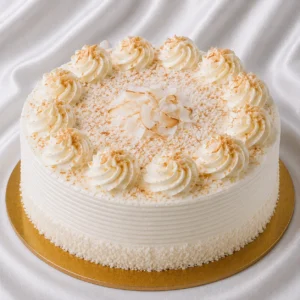 Coconut cake with smooth white coconut
cream and toasted coconut flakes